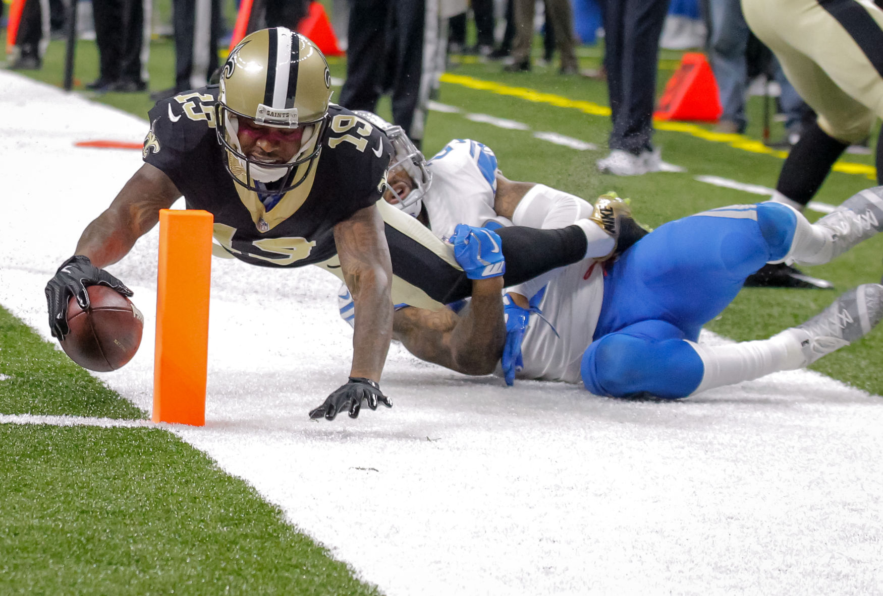 FIRST QUARTER - Saints' Ted Ginn dives for TD
